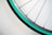 A close-up of a bicycle wheel with shiny spokes and a vibrant tire.