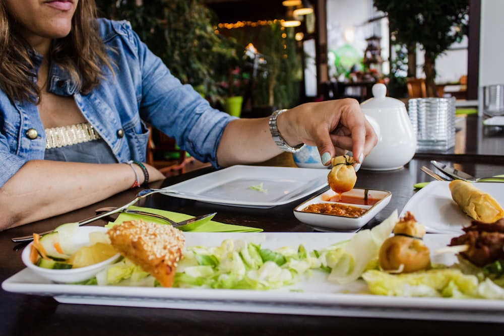 woman sits near table