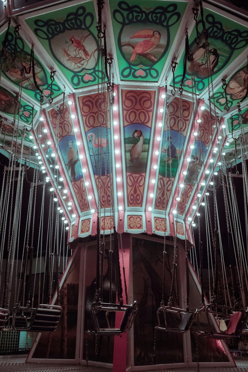 closeup photo of lighted carousel swing