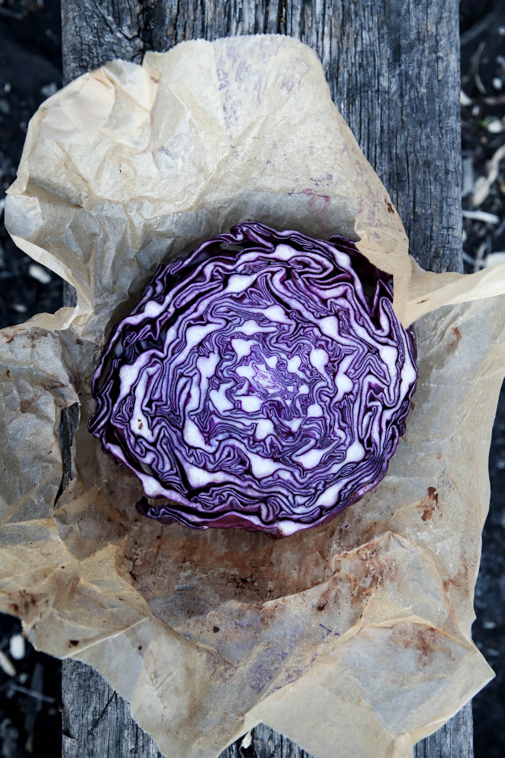 purple and white stone on white paper