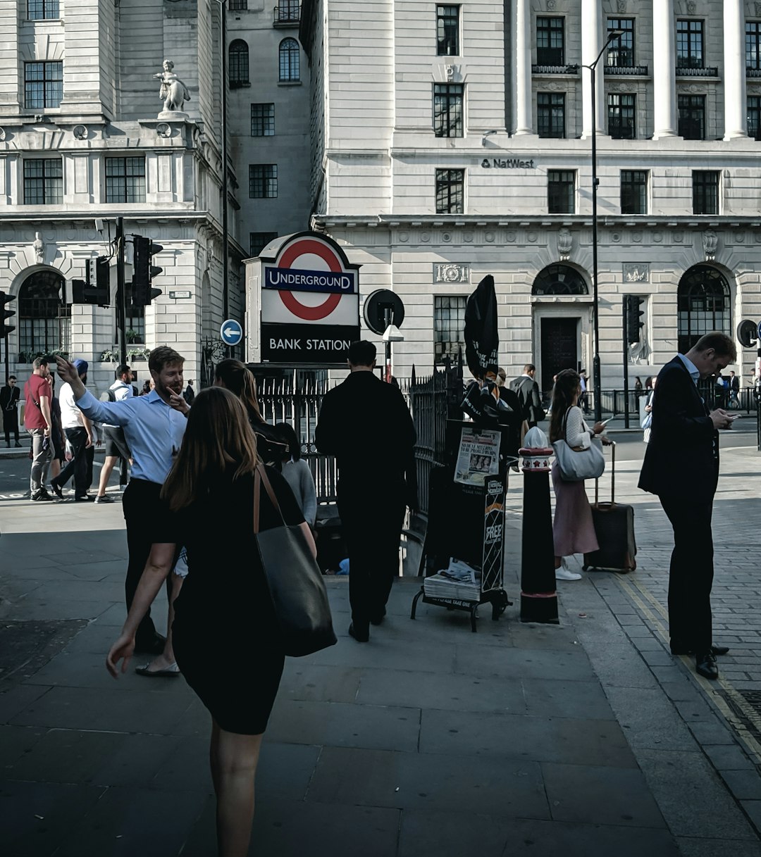 woman in black at a sidewalk