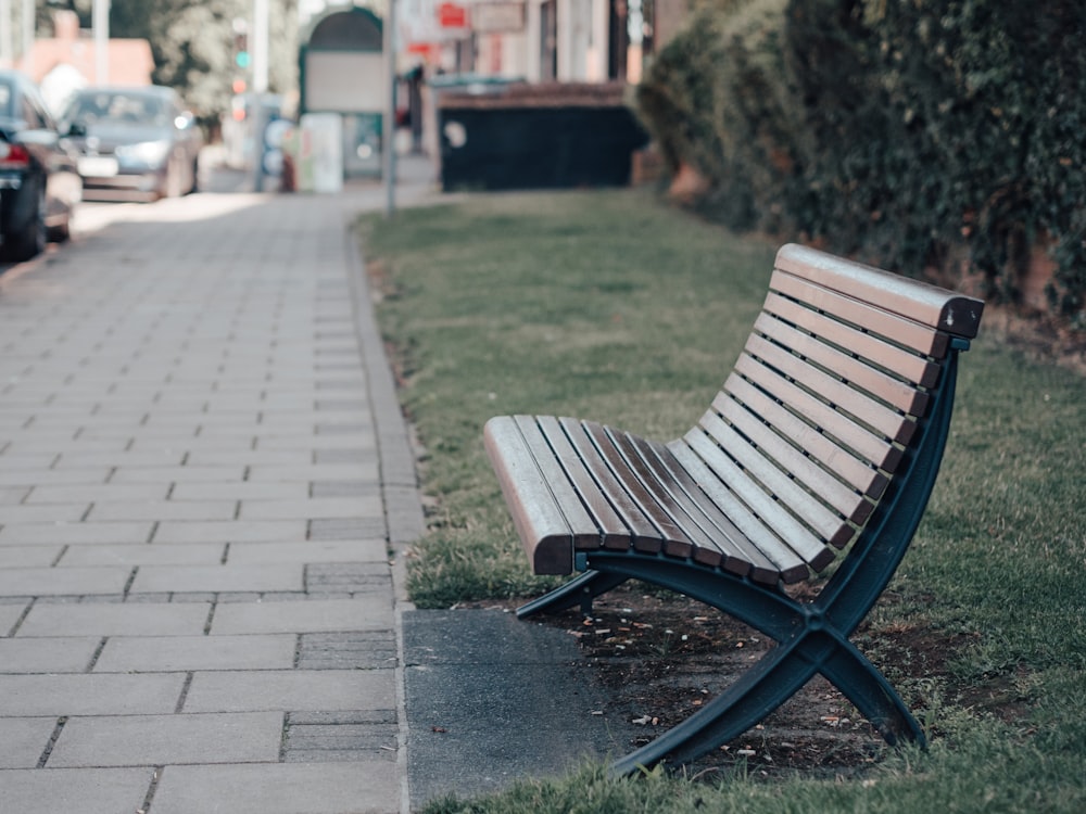 wooden bench near bush