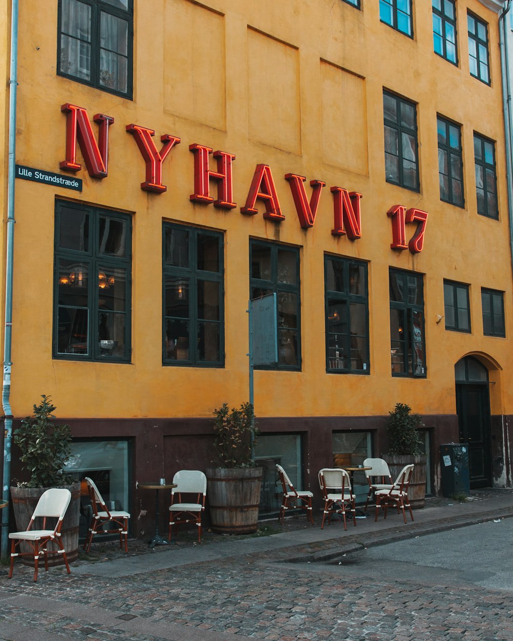 yellow and black concrete building at daytime