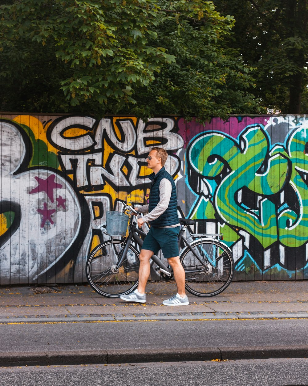 man carrying bike