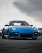 blue luxury porshe on premium tyres sold at the tyrepublic tire shop in lagos