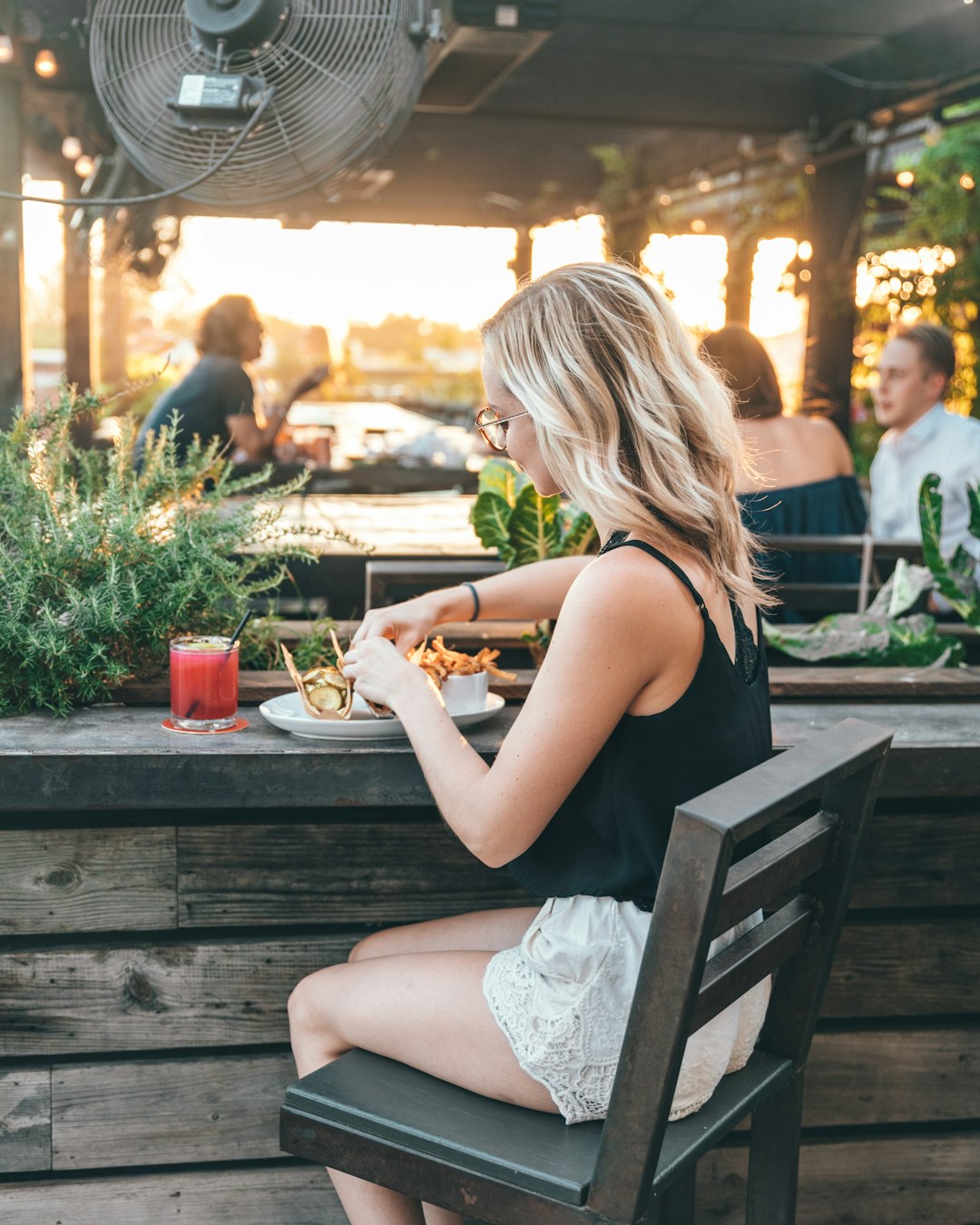 woman sits near table