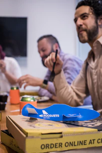 Satisfied customers enjoying meals served by The Food Kompany, Inc at a community event.