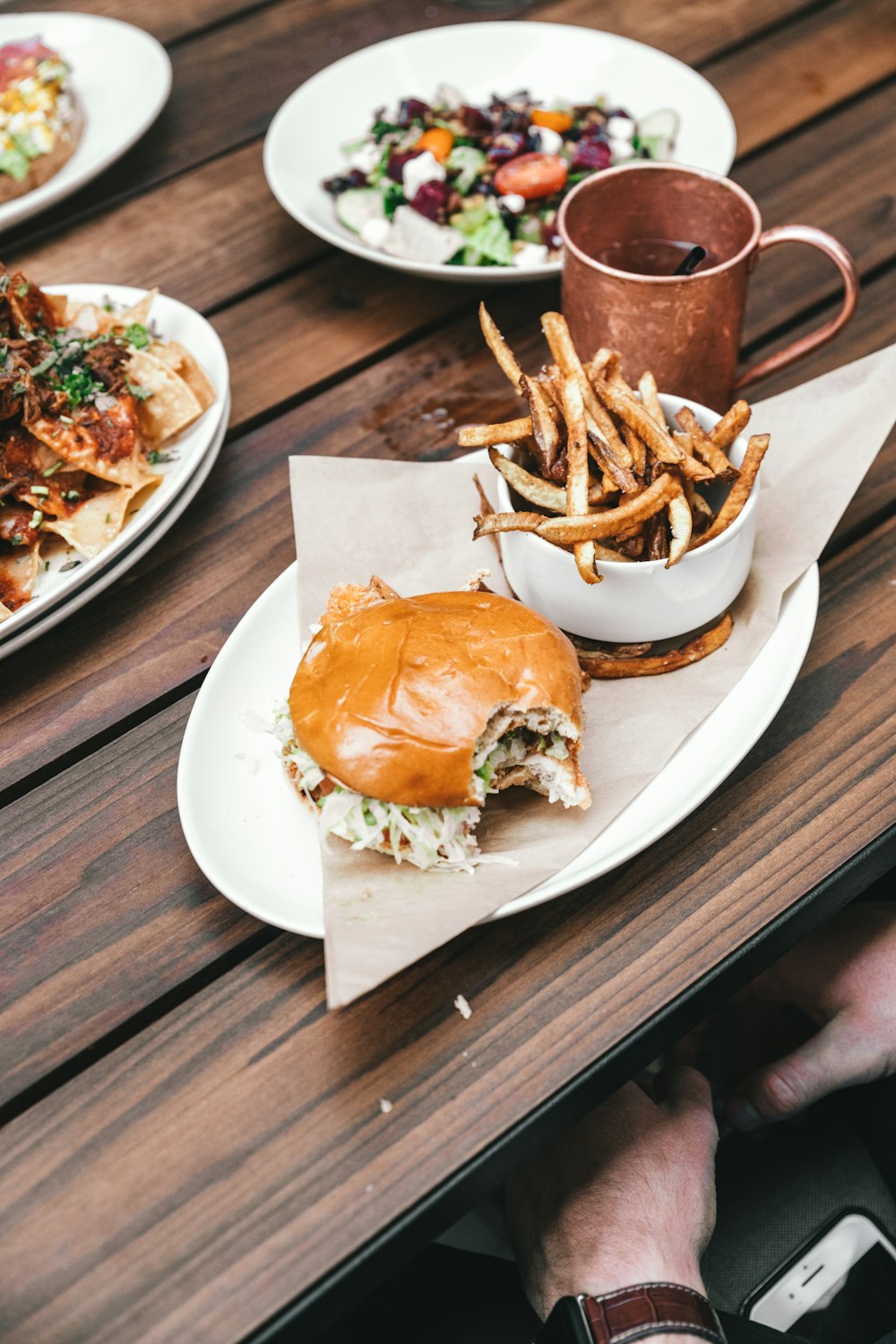 burgers and fries on oval plate