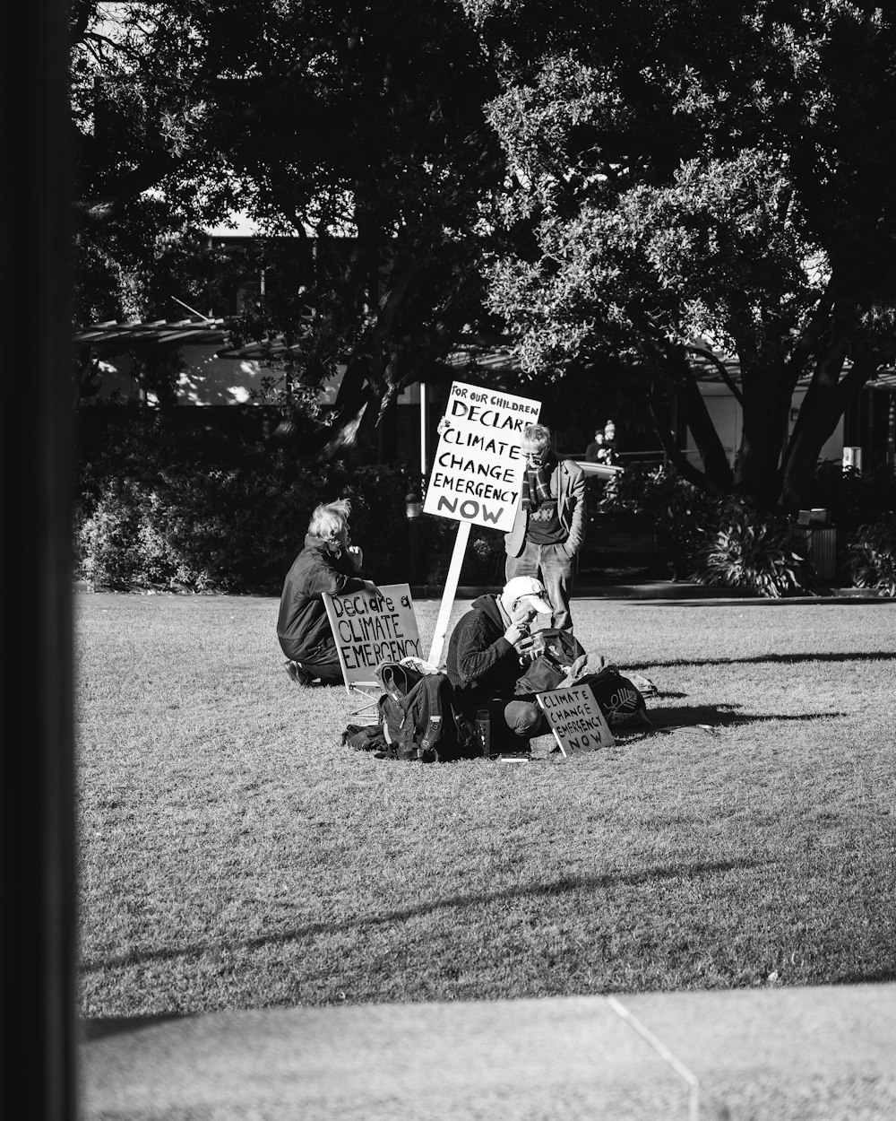 people holding signages