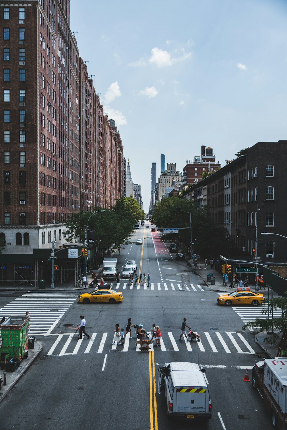 people crossing on road during daytime