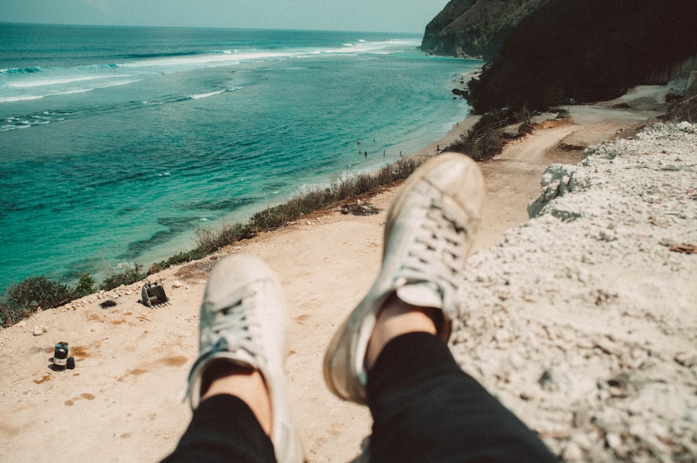 person siting near body of water