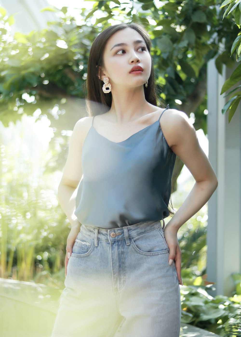 woman in gray spaghetti strap top