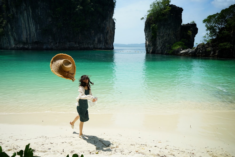 woman standing beside sea