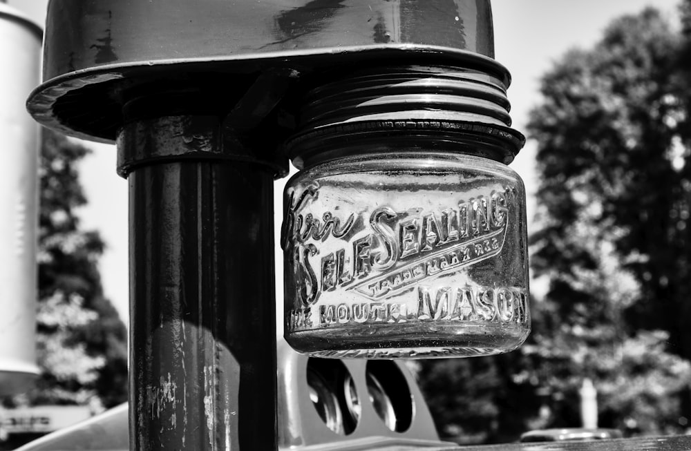 a close up of a glass jar on a pole