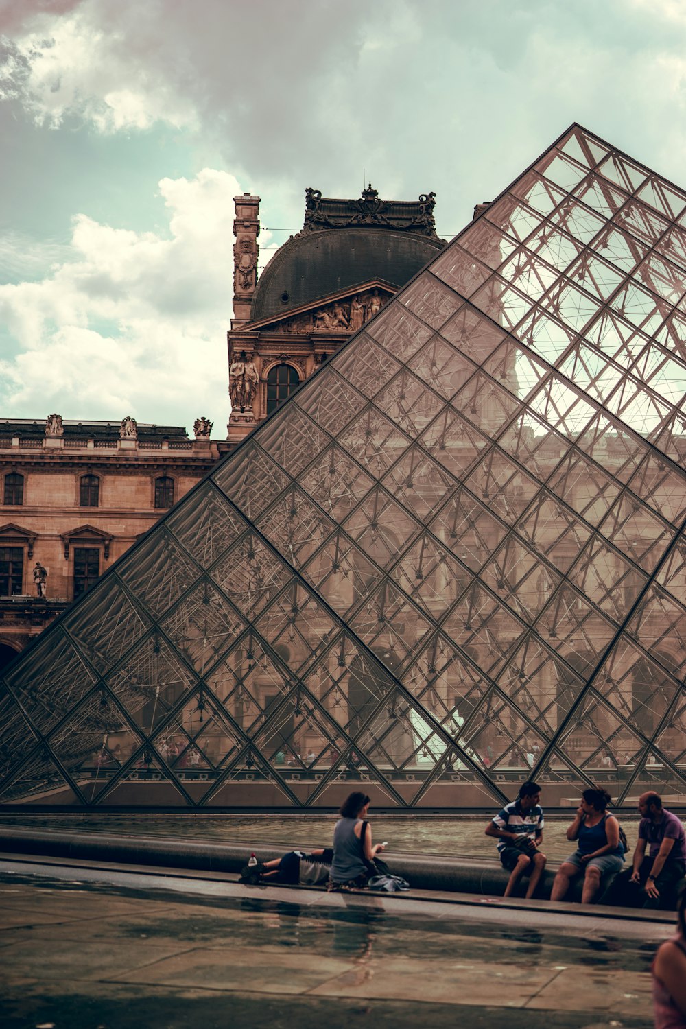 people gathering outside Louvre Museum