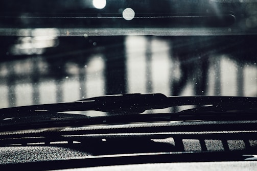 Close-up of a set of car wiper blades arranged neatly on a white background