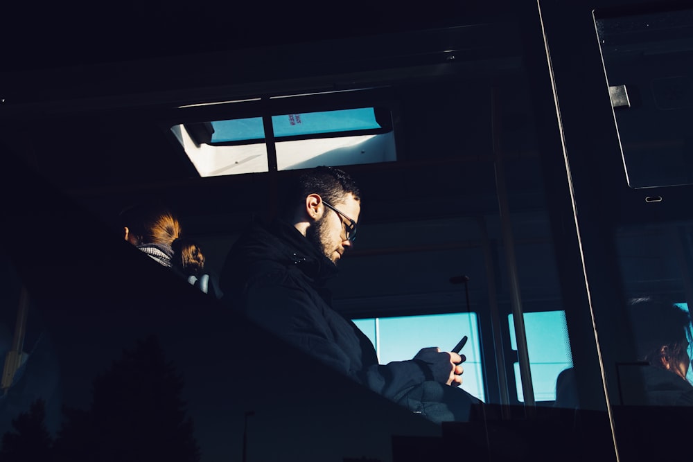 people inside public transpiration vehicle during day