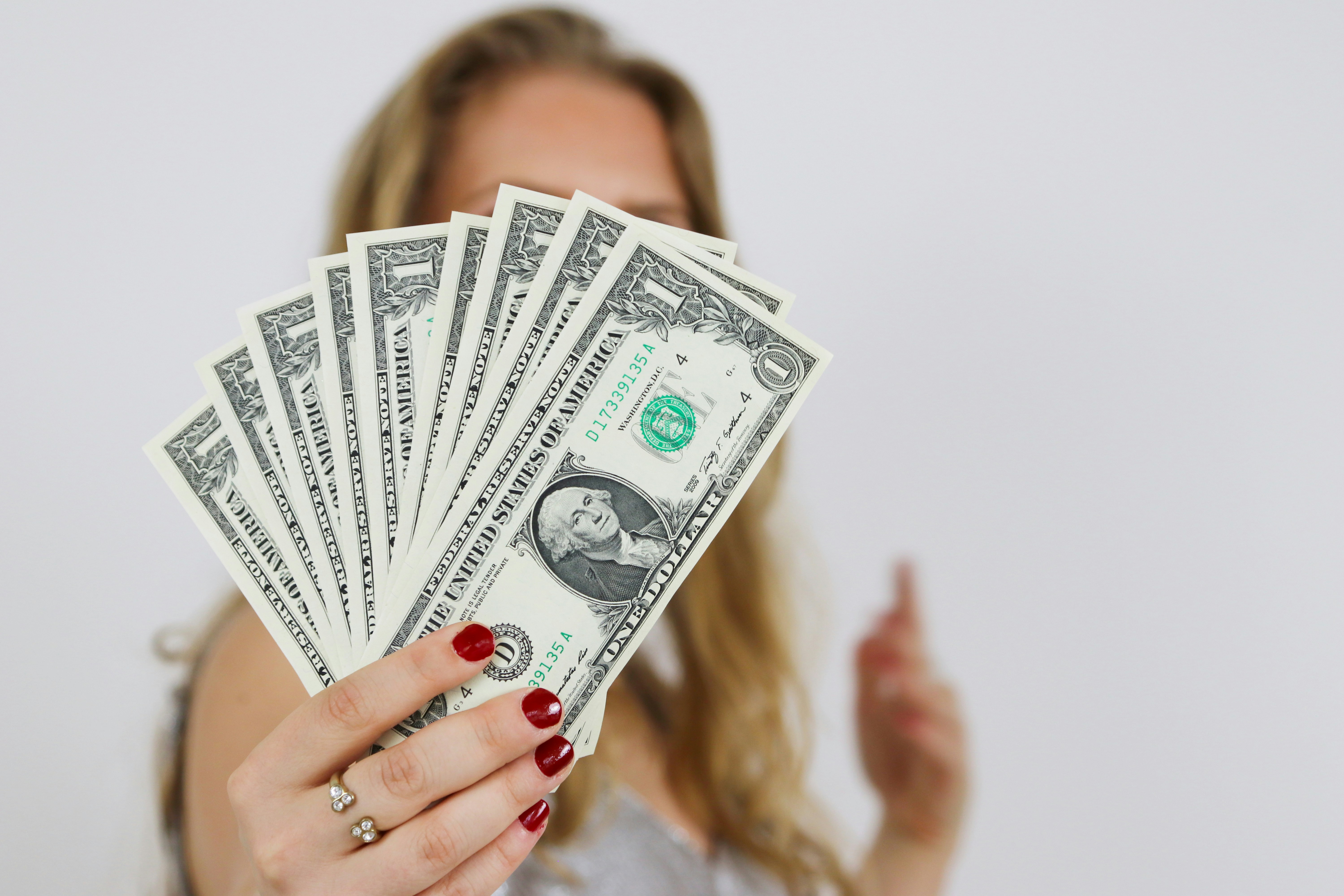 selective focus photography of 1 US dollar banknotes