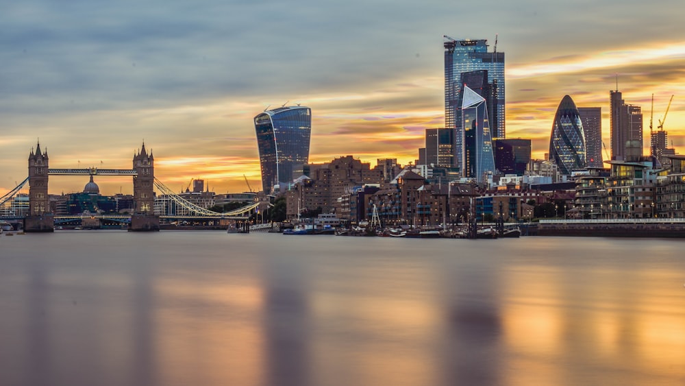 London Tower Bridge under grey and orange cloudy sunset sky