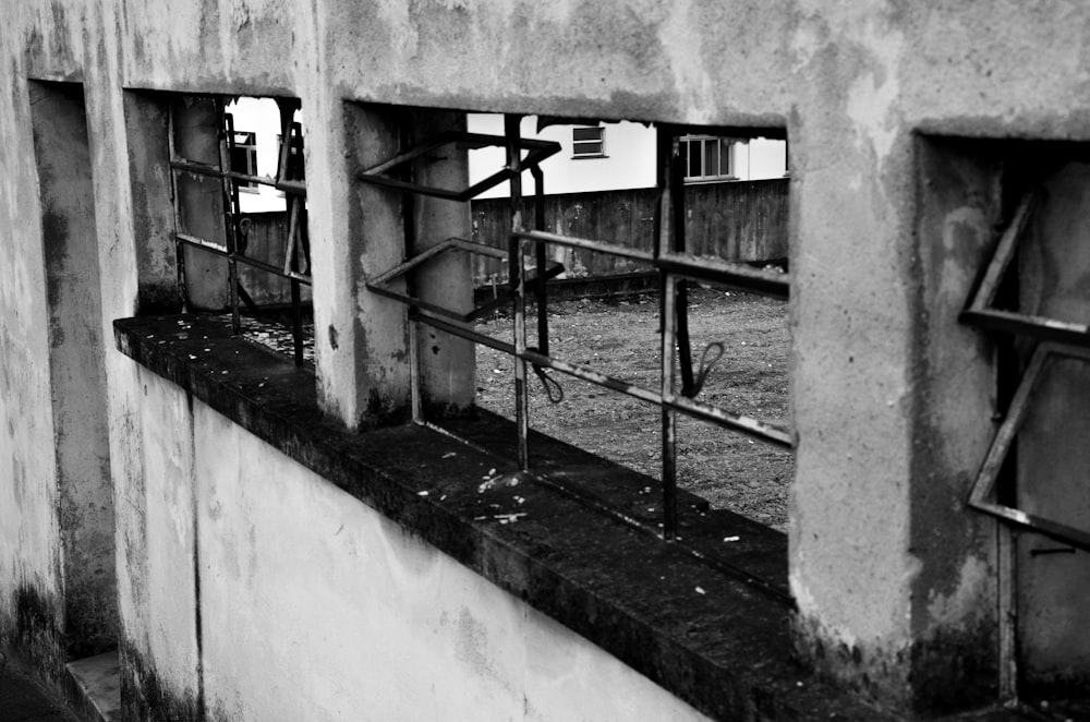 a black and white photo of a window in a building