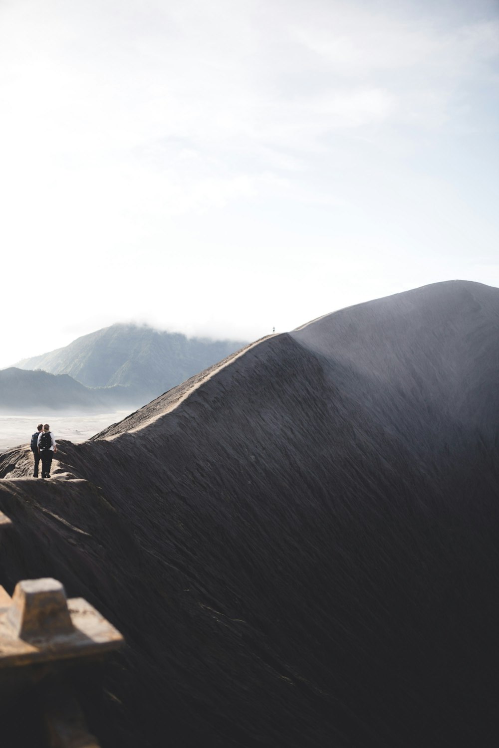 two men standing on singing sand