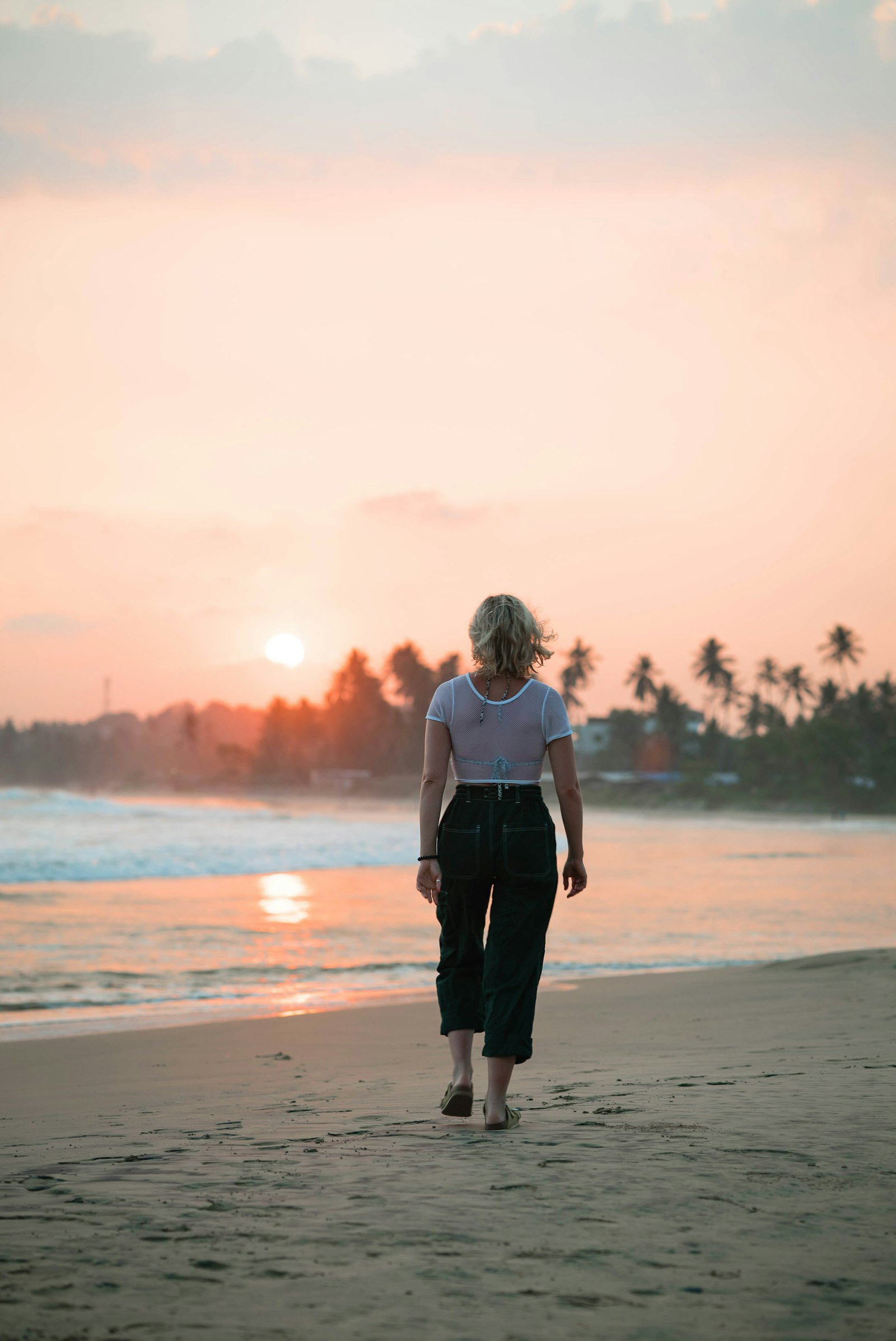 Sony a7S II + Sony FE 85mm F1.4 GM sample photo. Women walking seashore during photography