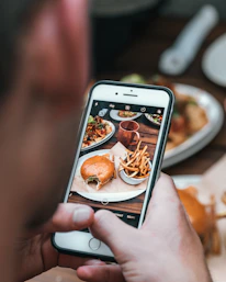 silver iPhone 6 with black case close-up photography