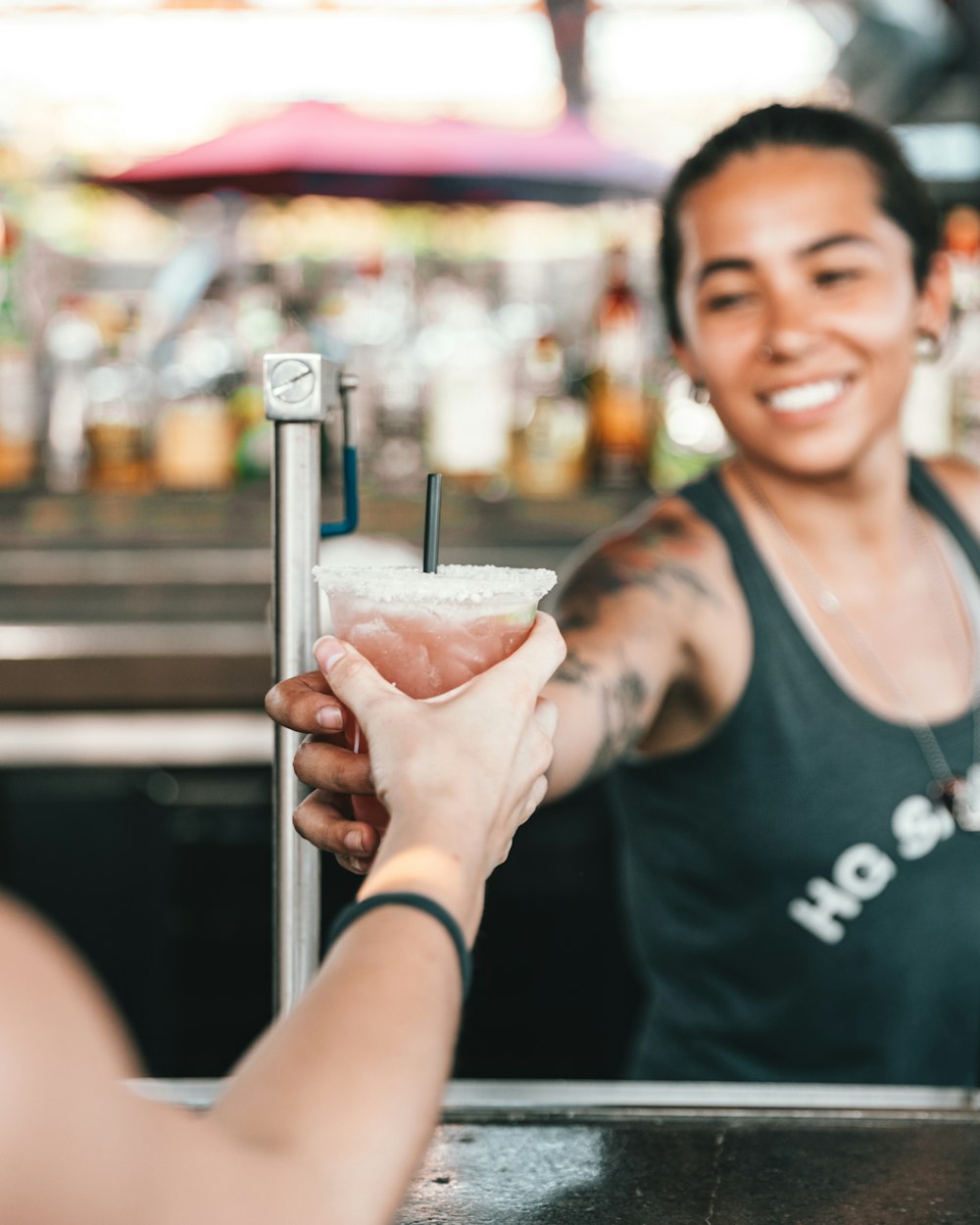 woman leaning a drink