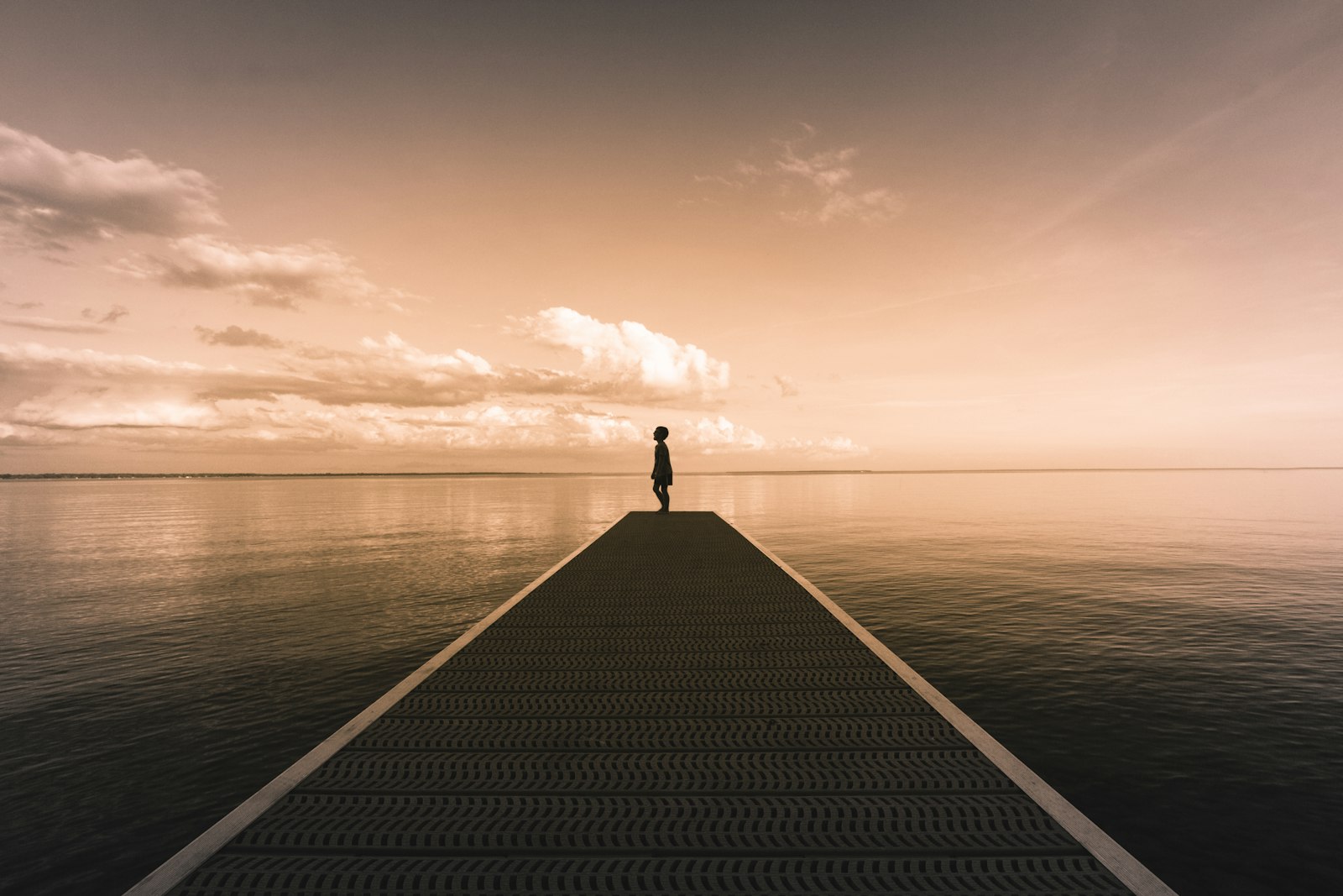 Canon EOS 60D + Canon EF-S 10-22mm F3.5-4.5 USM sample photo. Boy standing on dock photography