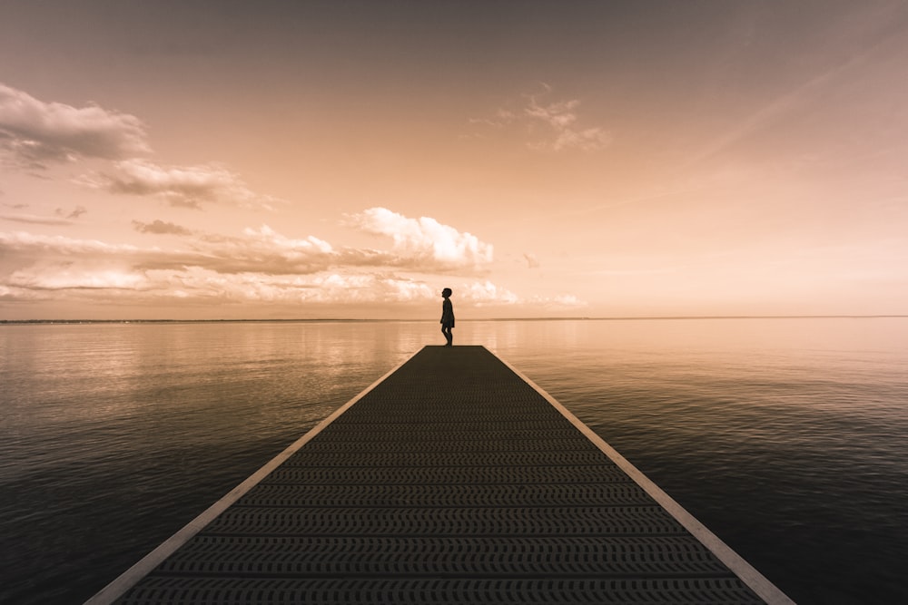 boy standing on dock