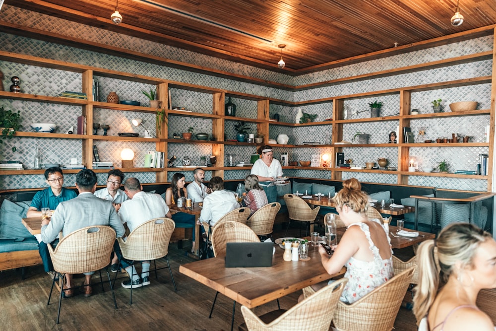 people sitting inside restaurant close-up photography