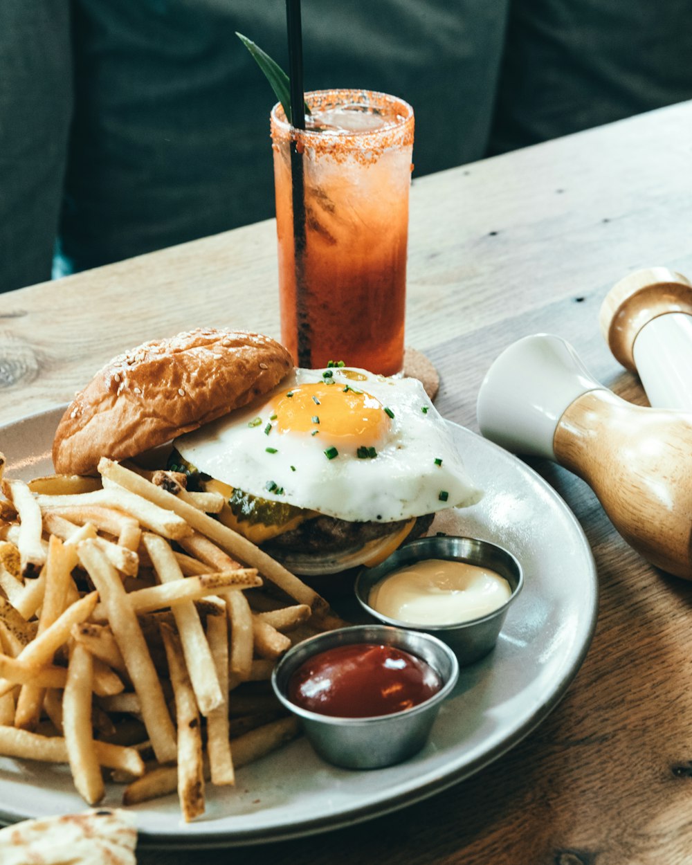 french fries and burger with sunny side up