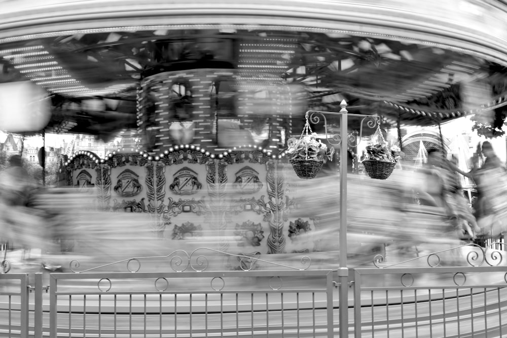 blurry photograph of a merry go round ride