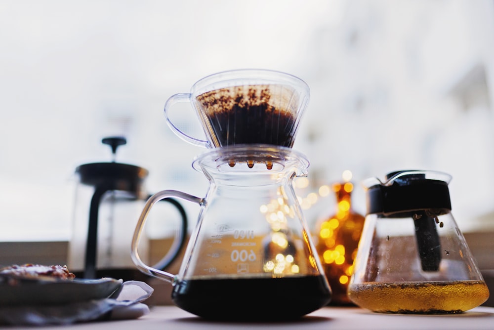 pure black coffee dripping on carafe at the table