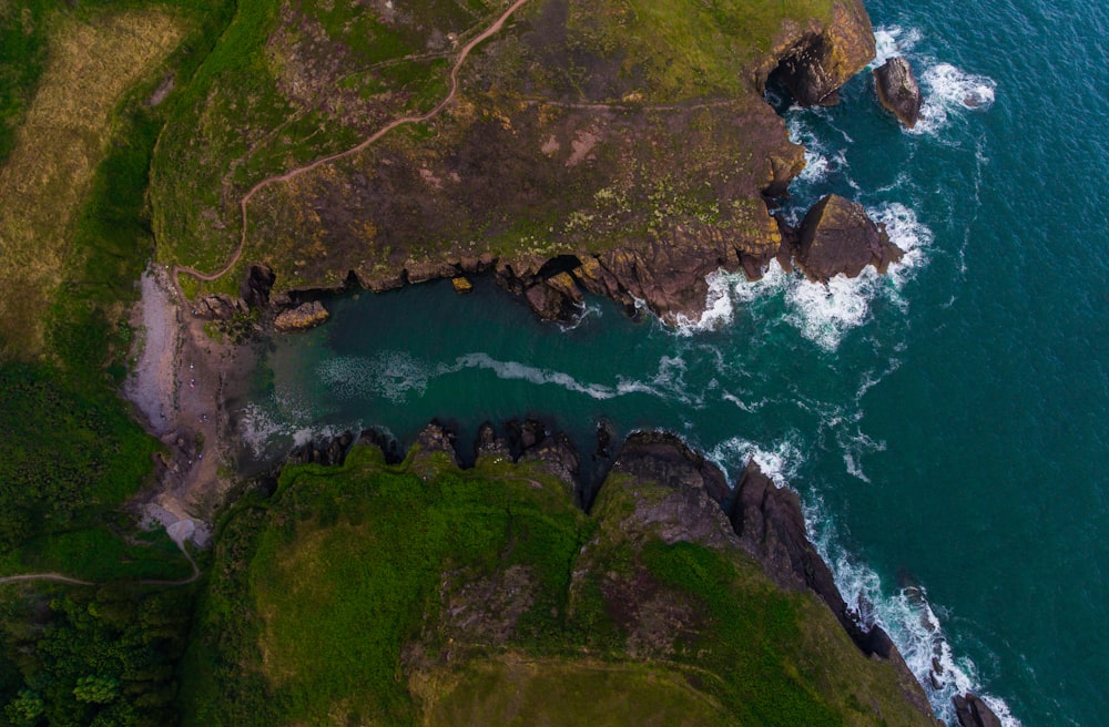 aerial photography of mountain and seashore