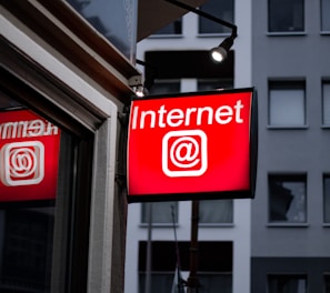 Internet LED signage beside building near buildings