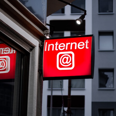 Internet LED signage beside building near buildings