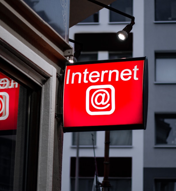 Internet LED signage beside building near buildings