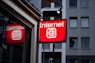 Internet LED signage beside building near buildings