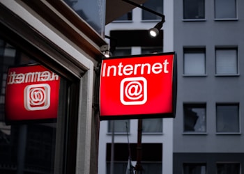 Internet LED signage beside building near buildings