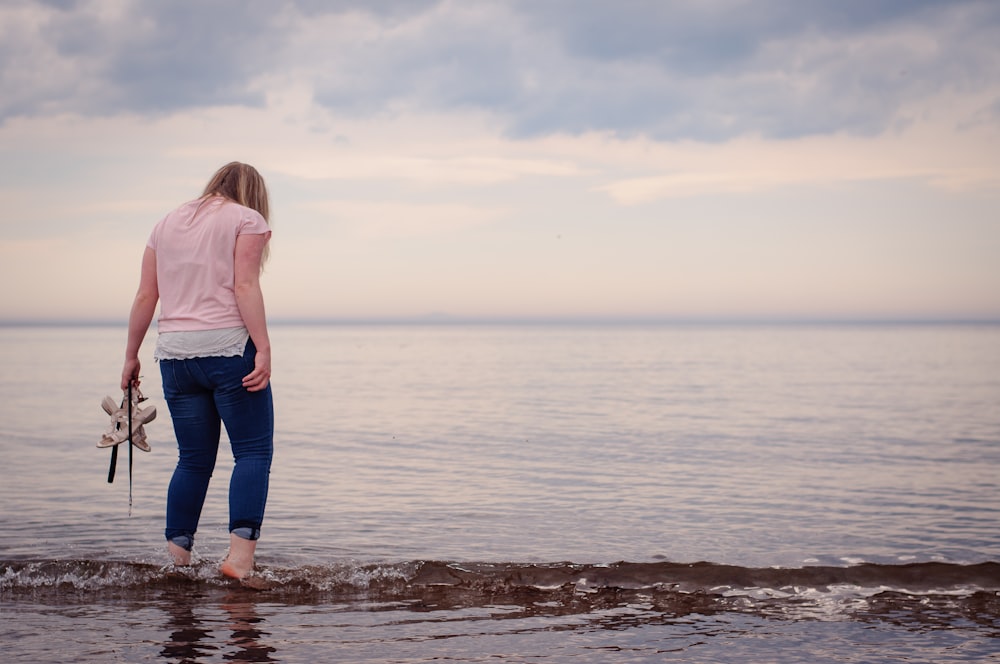 woman standing on shore