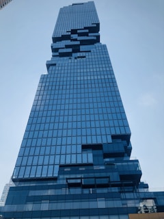 A futuristic high-rise with digital data streams overlaying the structure.