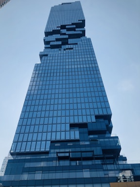 A futuristic high-rise with digital data streams overlaying the structure.