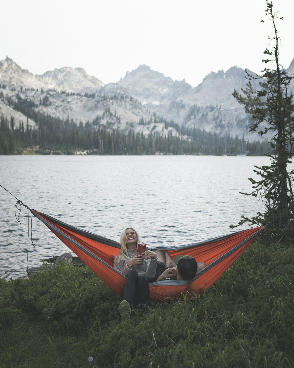 two person riding on hammock swing