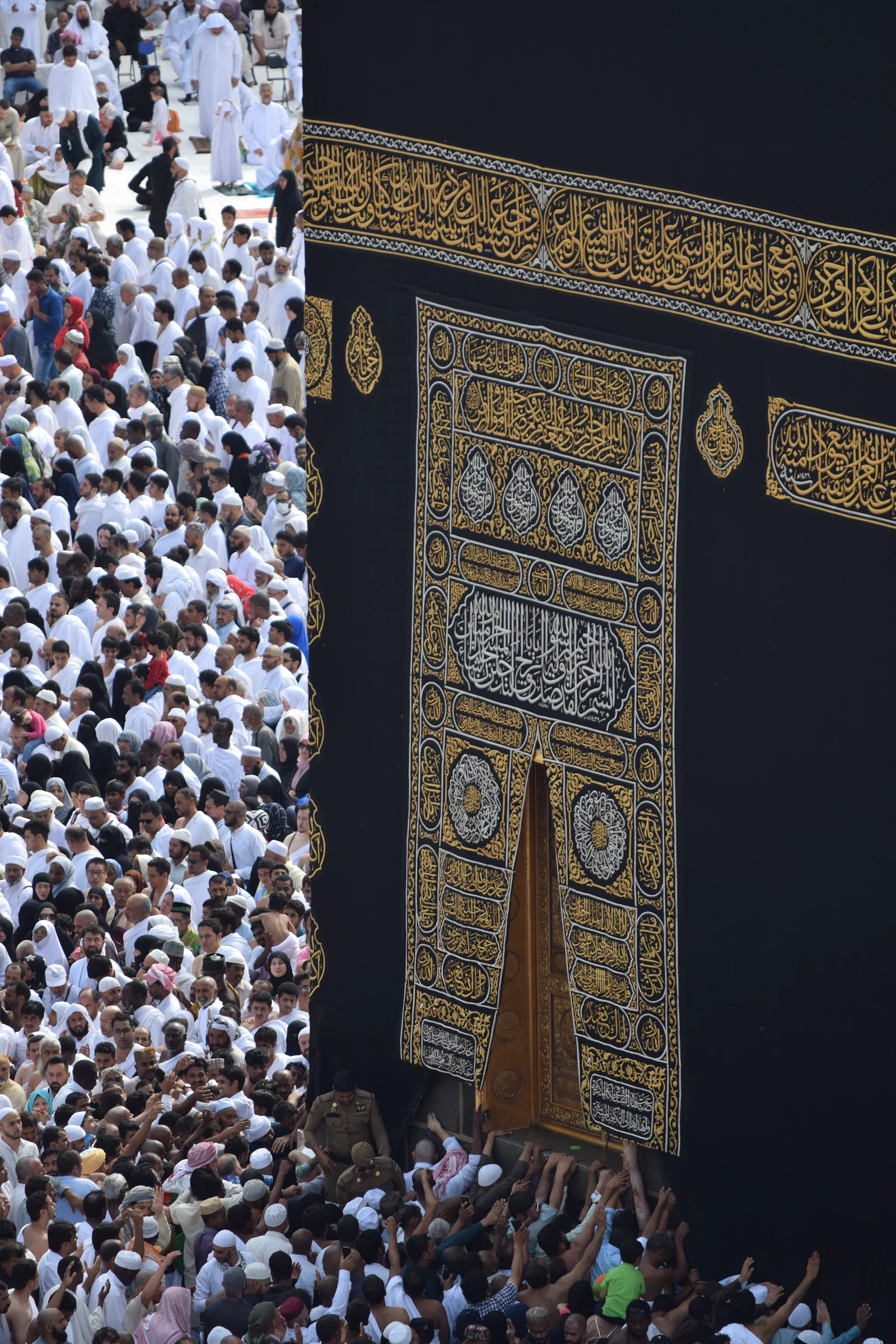 The door of the Kaaba with pilgrims gathered, Makkah