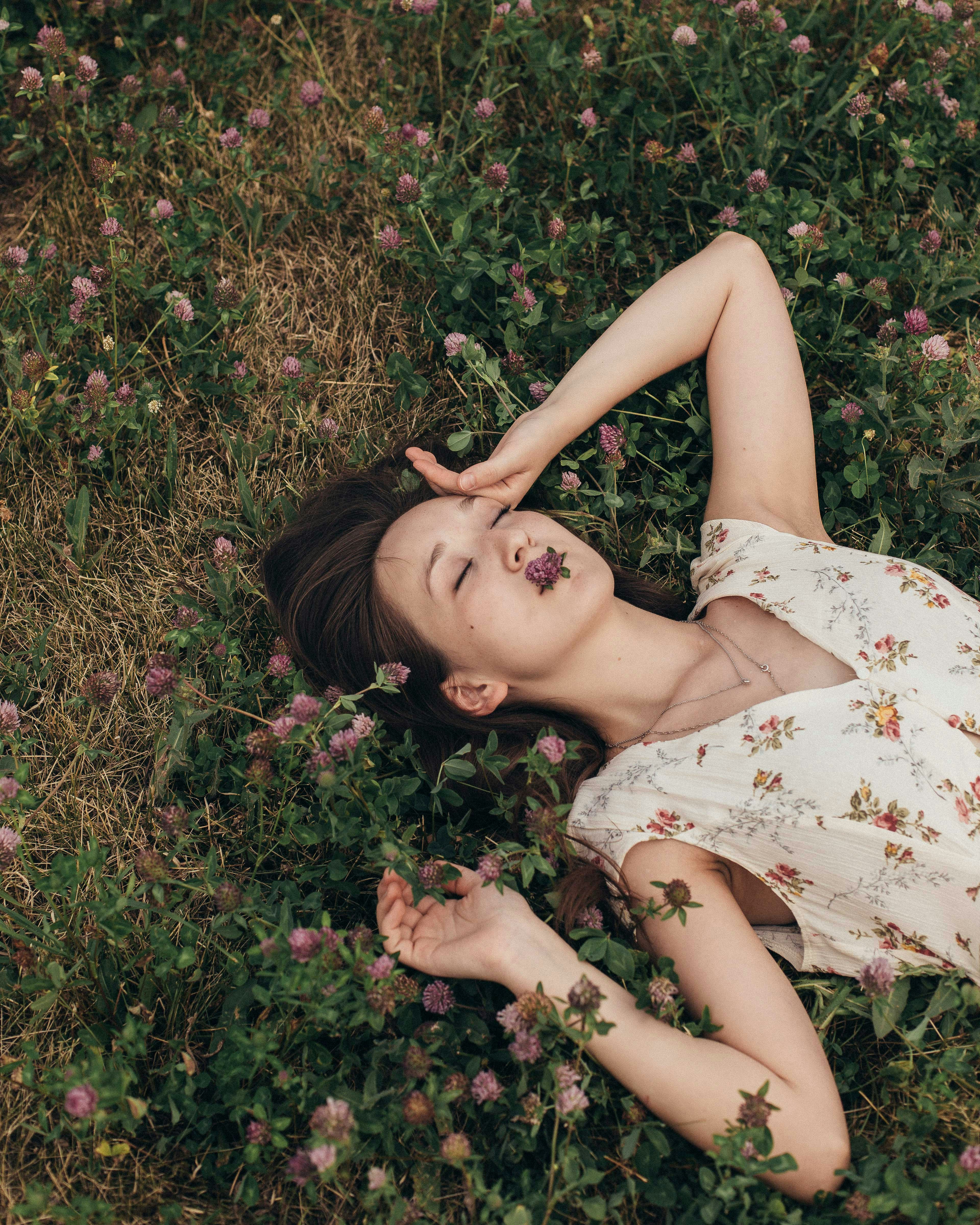 woman lying on grass