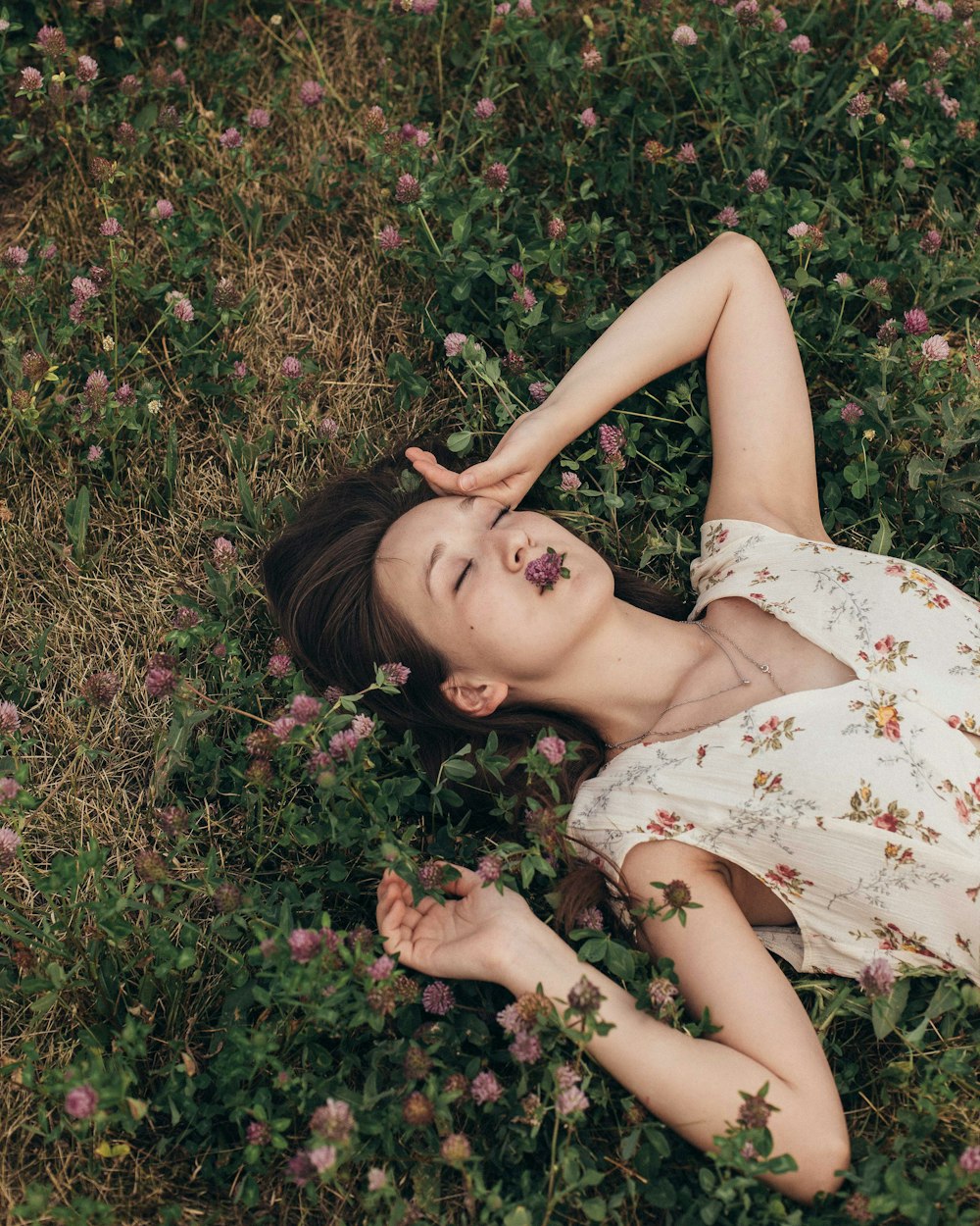 woman lying on grass