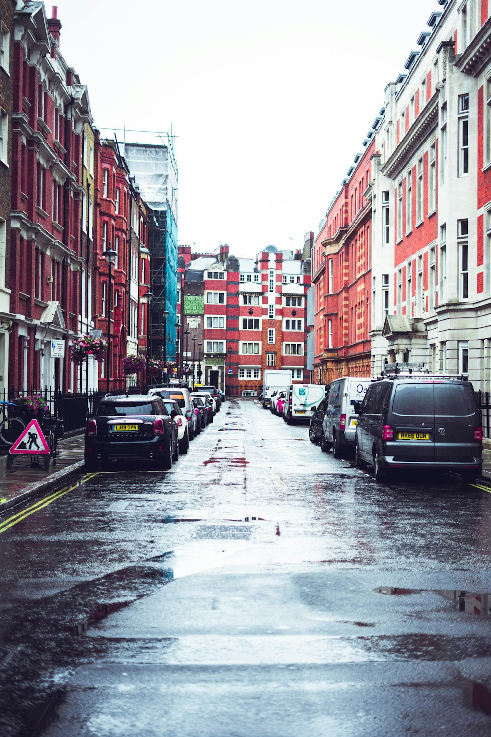 parked cars beside buildings