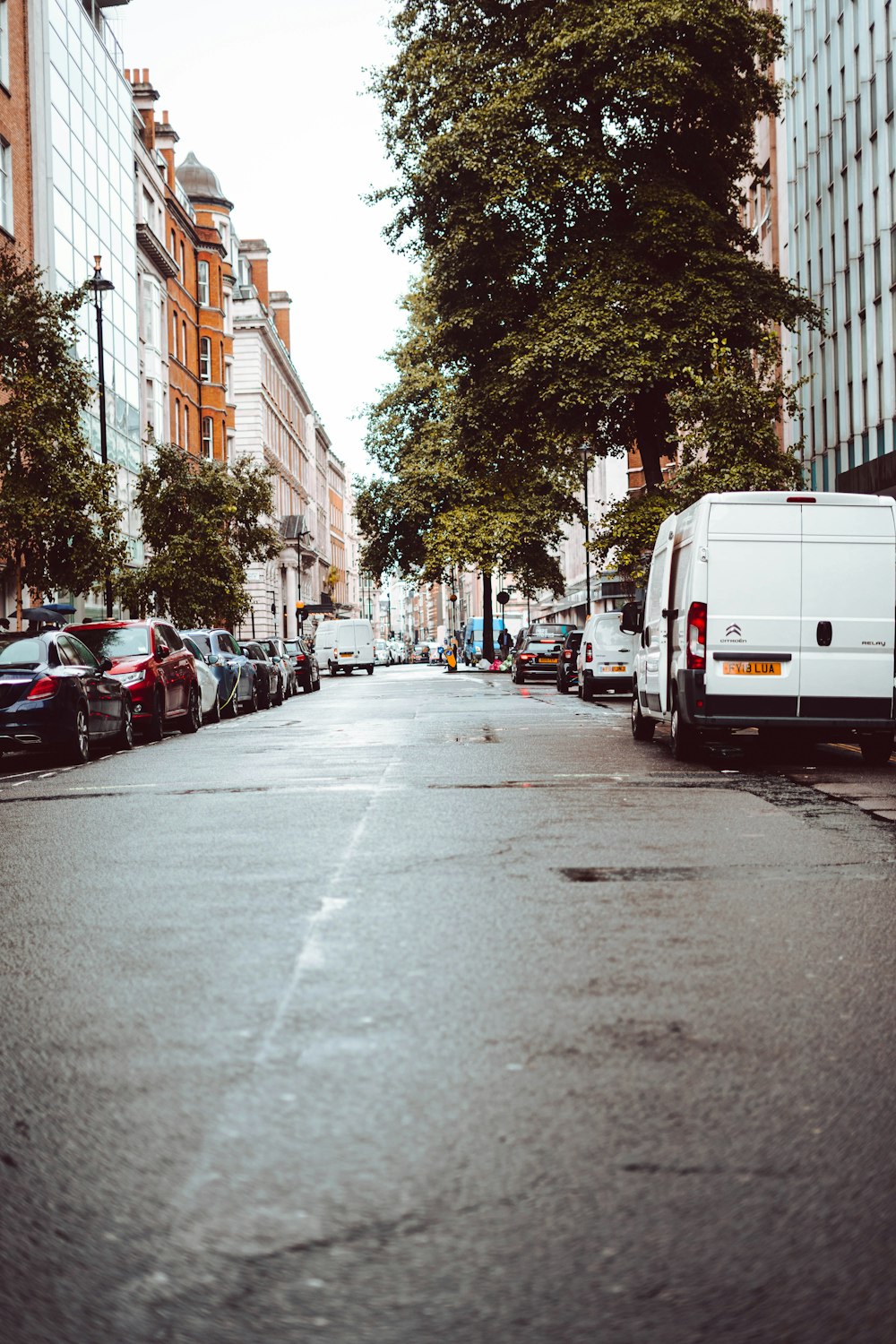 vehicles parked on roadside during daytime