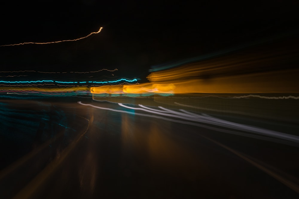 a blurry photo of a street at night